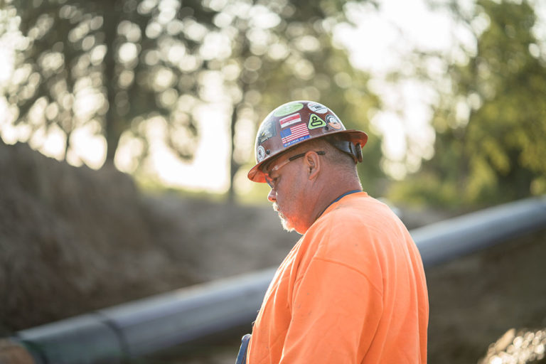 Midwest Mole employees working on the field