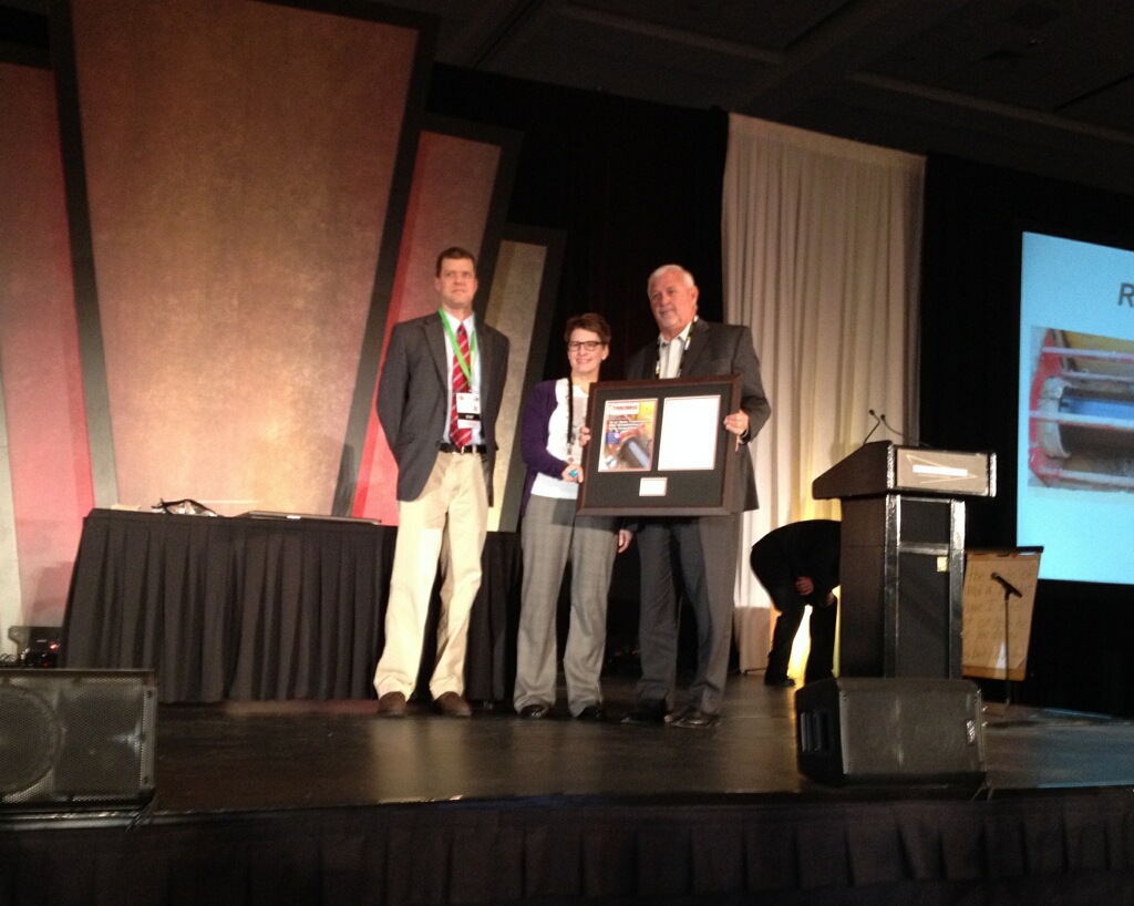 Tom Haynes, from Murphy Pipeline Contractors, accepted the 2014 Trenchless Technology Project of the Year award for rehabilitation from Trenchless Technology editor Jim Rush and managing editor Sharon Bueno.