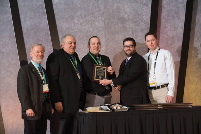 NASTT board members Dan Willems and Kevin Nagle (far right) presented the 2014 Outstanding Paper Rehabilitation winner: Paul Pasko, SEH Inc., Jim Wojcehowicz, Wauwatosa, Wis., and John Richmond, P.E.; Marshfield Utilities.